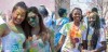 Cornell students covered with colored powder at the Holi festival