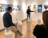 a person doing a presentation in a design gallery