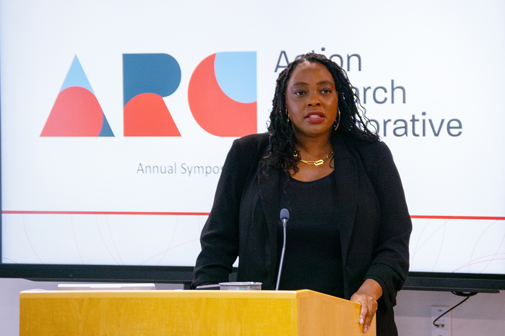 woman speaks at lectern