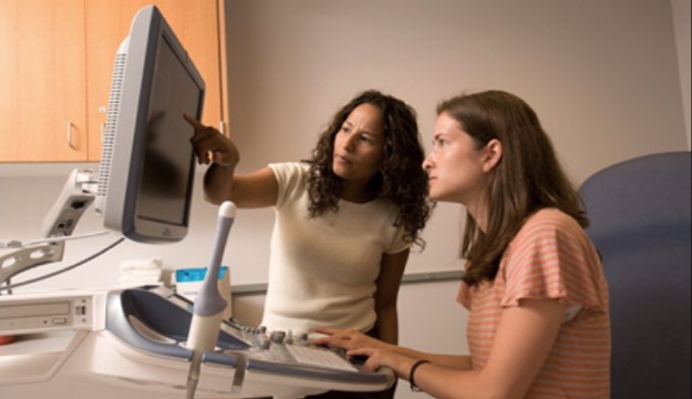 Marla Lujan and Brittany Jarret at ultrasound monitor