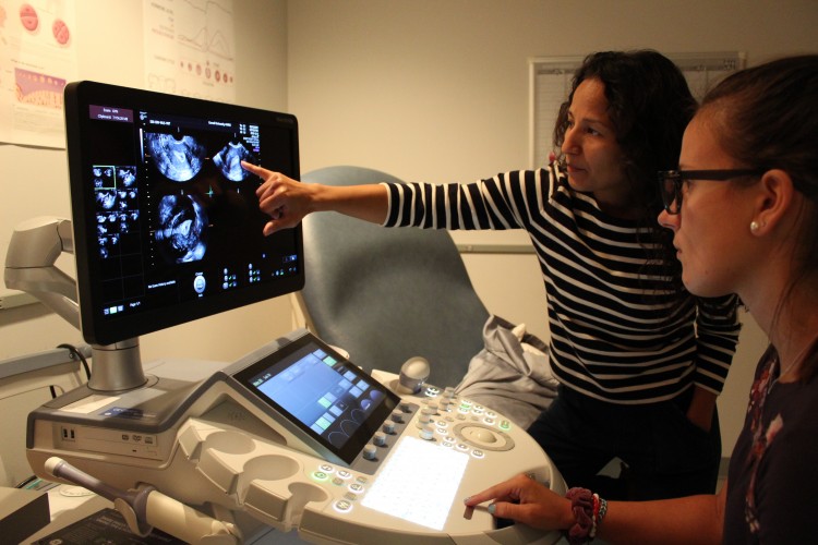 marla lujan and lab member at ultrasound machine