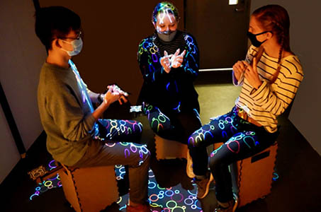 Students sitting on stools