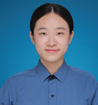portrait of a smiling person in a blue button up shirt