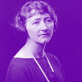 purple tinted photo from the 1920s of a woman wearing pearls