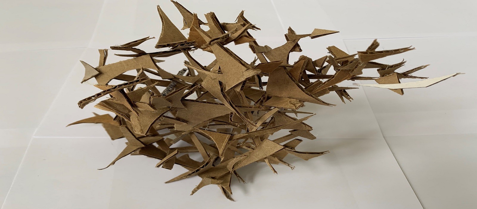 Recycled cut offs from cardboard box recycled sculpture
