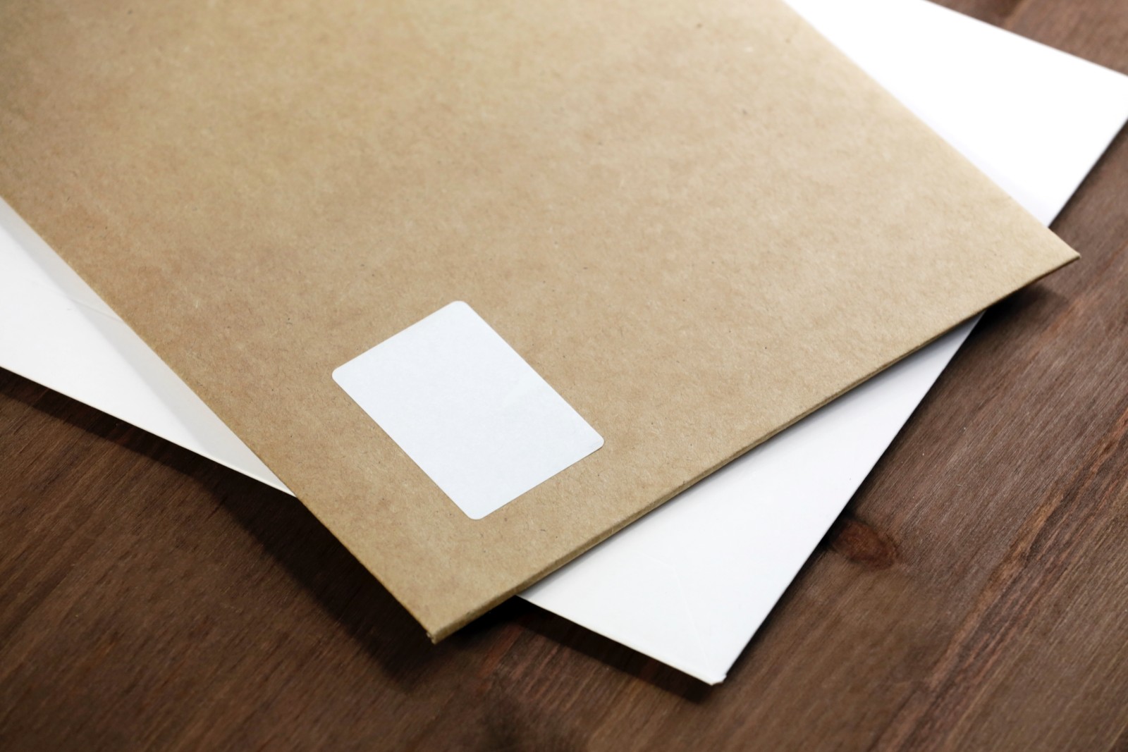 brown and white envelopes stacked