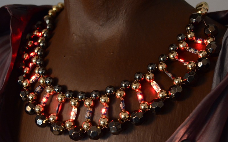 Illuminated necklace on black mennequin