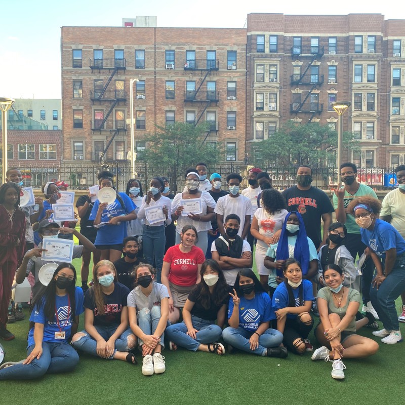 group of Cornell students and local teens pose in NYC