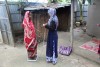 weighing a client in fieldwork in India