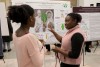 two students view an academic poster